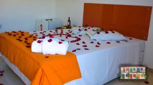 Кровать или кровати в номере Pousada Praia do Jabaquara