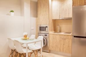 Kuchyňa alebo kuchynka v ubytovaní Apartamentos Boutique Salamanca