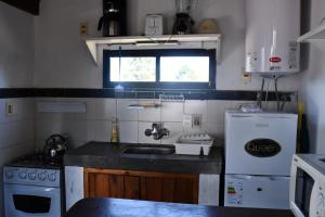 Una cocina o kitchenette en El Vuelo