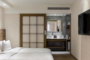 Katil atau katil-katil dalam bilik di Lan Kwai Fong Garden Hotel