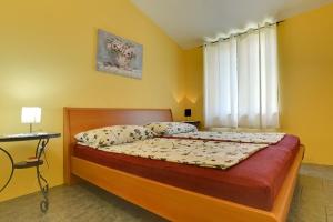 Voodi või voodid majutusasutuse Apartments Puntica toas