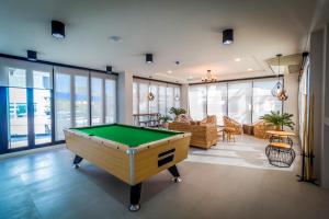 a living room with a pool table in it at Triple Z Hotel in Hua Hin