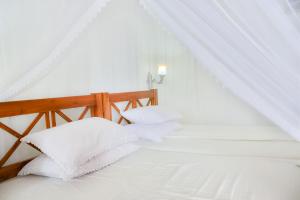 Postelja oz. postelje v sobi nastanitve Hotel Dolphin Hikkaduwa