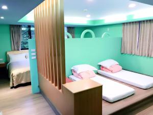 Postel nebo postele na pokoji v ubytování Sun Moon Lake Tan Hsiang Yu B&B