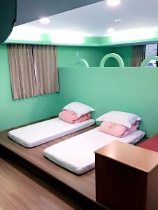 Postel nebo postele na pokoji v ubytování Sun Moon Lake Tan Hsiang Yu B&B