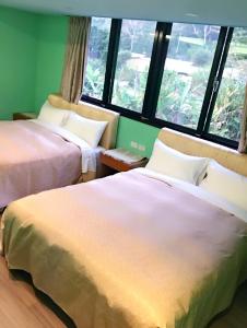 Postel nebo postele na pokoji v ubytování Sun Moon Lake Tan Hsiang Yu B&B