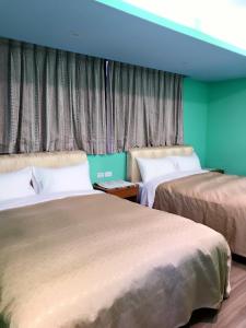 Postel nebo postele na pokoji v ubytování Sun Moon Lake Tan Hsiang Yu B&B
