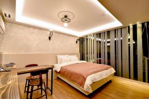Postel nebo postele na pokoji v ubytování Ulsan Hotel 109