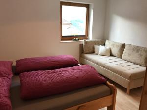 a living room with a couch at Pferdehof Bachegg in Tobadill