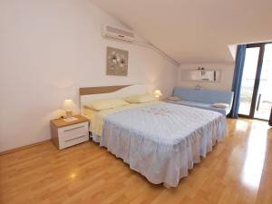 Postel nebo postele na pokoji v ubytování Apartments Milan 1048
