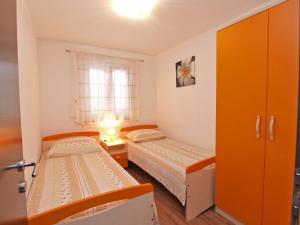 Postel nebo postele na pokoji v ubytování Apartments Milan 1048