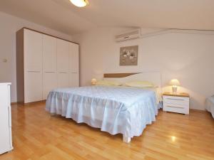 Postel nebo postele na pokoji v ubytování Apartments Milan 1048