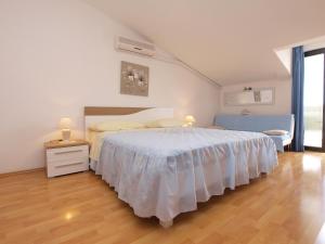 Postel nebo postele na pokoji v ubytování Apartments Milan 1048