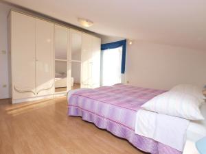Postel nebo postele na pokoji v ubytování Apartments Milan 1048