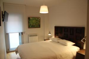 Posteľ alebo postele v izbe v ubytovaní Apartaments Centre Figueres