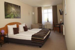Cama o camas de una habitación en Gut Hotel Stadt Beelitz