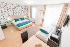 Postel nebo postele na pokoji v ubytování Prince Apartments