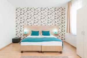 Postel nebo postele na pokoji v ubytování Prince Apartments