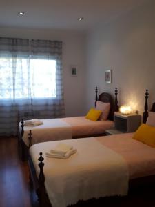 Uma cama ou camas num quarto em Villa Benedito