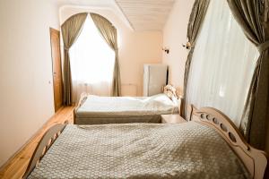 Кровать или кровати в номере Беловежская Пуща - Отельный Комплекс Жарковщина