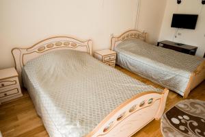 Krevet ili kreveti u jedinici u okviru objekta Belovezhskaya Pushcha Hotel complex Zharkovshina