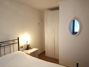 A bed or beds in a room at Marmot Apartment