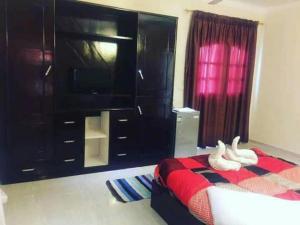 Postel nebo postele na pokoji v ubytování Gold Ibis Hotel