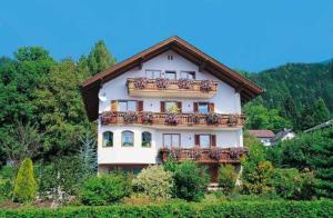 a large house with balconies on the side of it at Appartementhaus Sonne in Millstatt