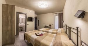 Postel nebo postele na pokoji v ubytování Borgomaestro B&B