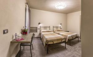 Postel nebo postele na pokoji v ubytování Borgomaestro B&B