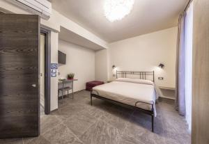 Postel nebo postele na pokoji v ubytování Borgomaestro B&B