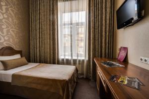 Кровать или кровати в номере Отель Атриум