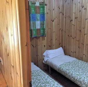 Łóżko lub łóżka w pokoju w obiekcie Camping Riaza