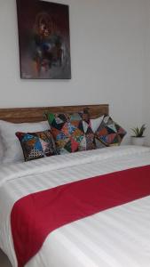 Postel nebo postele na pokoji v ubytování Anugrah Jaya Guest House