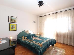 Postel nebo postele na pokoji v ubytování Apartment Luisa 1437