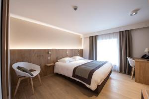 Postel nebo postele na pokoji v ubytování Hotel Le Fournil