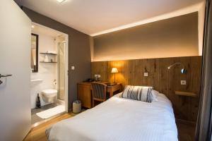 Postel nebo postele na pokoji v ubytování Hotel Le Fournil