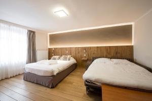 Postel nebo postele na pokoji v ubytování Hotel Le Fournil
