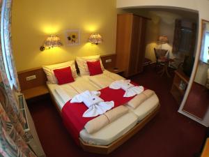 Voodi või voodid majutusasutuse Ambiente Hotel Strehla toas