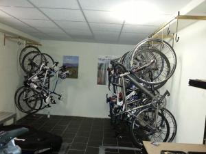 two bikes hanging on a wall in a room at Hotel Life in Rimini