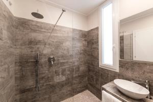 a bathroom with a shower and a sink at Hotel Life in Rimini