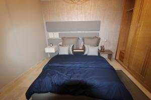 Un pat sau paturi într-o cameră la Residence Touristique La Rambla