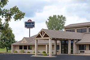 a rendering of the entrance to the american inn at AmericInn by Wyndham Tomah in Tomah