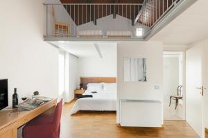 Un pat sau paturi într-o cameră la Il Borgo Ritrovato - Albergo Diffuso