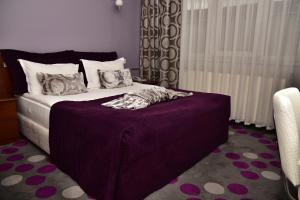 Ένα ή περισσότερα κρεβάτια σε δωμάτιο στο Hande Hotel