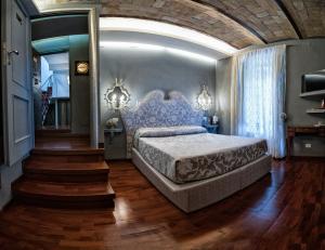 Posteľ alebo postele v izbe v ubytovaní Hotel Antica Locanda