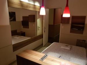 a bathroom with two beds and a mirror at Namorata Expo Inn in São Paulo +52 photos