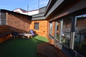 a patio with a table and chairs on a balcony at Air Loft Apartment in Kyiv