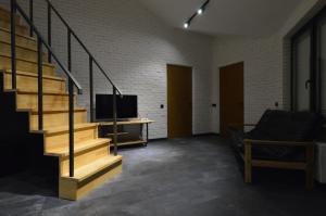 TV i/ili multimedijalni sistem u objektu Air Loft Apartment