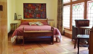 A bed or beds in a room at La Flamenca Inn